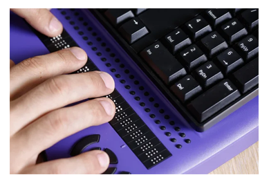 hands reading refreshable braille display